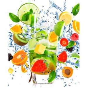 A glass of water with fruit and leaves in it.