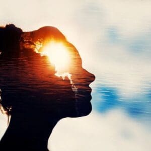 A woman is looking up at the sky