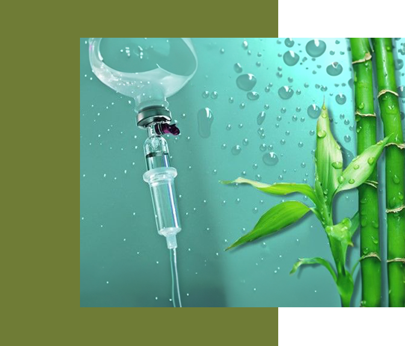 A picture of an injection and bamboo in the water.